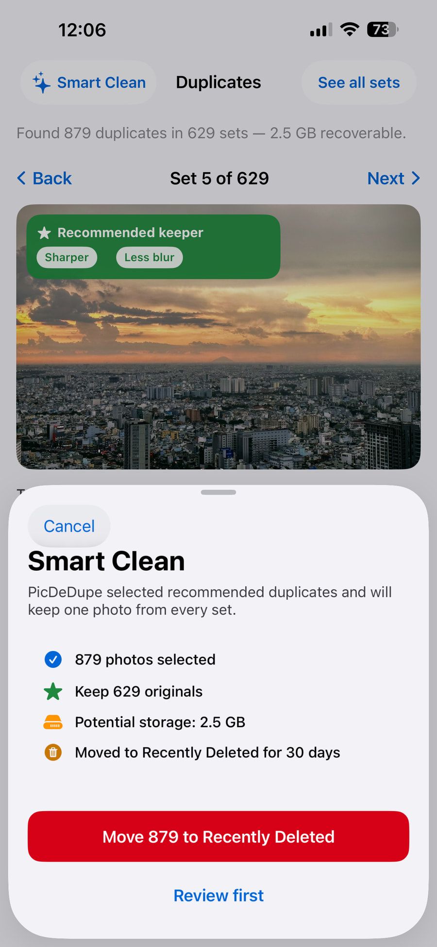 PicDeDupe’s Smart Clean sheet, showing a recommended keeper marked “Sharper” and “Less blur”, with options to review first or move duplicates to Recently Deleted.